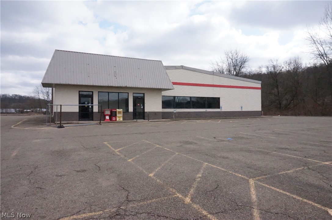 Great commercial property in a high traffic area of Millersburg. Over 15,000 square feet, and 12 foot high ceiling height. Large asphalt parking lot. Frontage on South Washington Street. At a light intersection with Wal-Mart.
