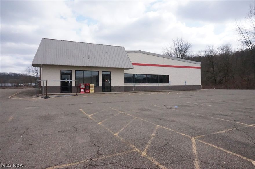 Great commercial property in a high traffic area of Millersburg. Over 15,000 square feet, and 12 foot high ceiling height. Large asphalt parking lot.  Frontage on South Washington Street.  At a light intersection with Wal-Mart.