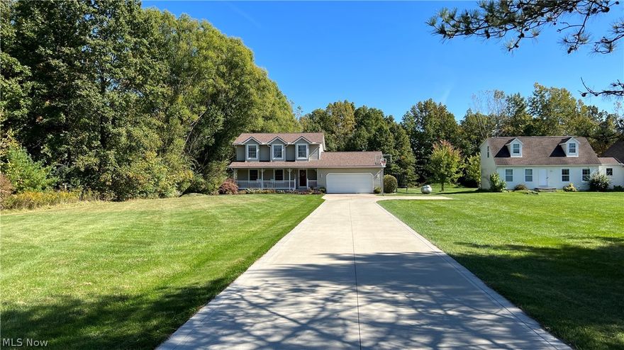 Life in this lovely home feels like country living yet has all the convenience of being close to town with easy access to highways. Situated on a beautiful 1+ acre lot, this center-hall colonial has excellent curb appeal.  Neat landscaping and a peaceful front porch greet you as you enter. Take the center hall down to the warm and welcoming kitchen with seating around the island.  Refrigerator and Dishwasher stay. This home also has a dining room with space to make memories around the table, a cheerful living room, 3 nice-sized bedrooms, 2.5 baths, ample storage places, attached heated garage, and a partially finished basement.  Master Bath and 1/2 bath were remodeled in 2020. First level flooring includes updated engineered hardwood and ceramic tile. There is a small bonus room off of the kitchen that could be a mudroom or office.  New roof (tear-off) in 2017 and new hot water tank in 2022. This home has been well-loved, pleasantly updated, and carefully maintained. In addition to the