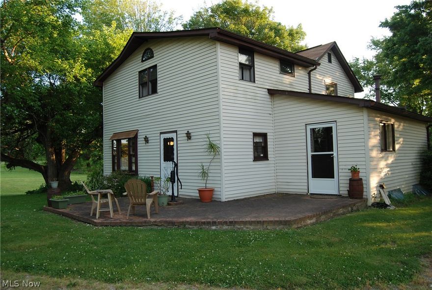 Charming 2 story remodeled farm house from 1901 era has lots of character. Located east on quite road with almost 2 acres surrounding it.
Lots of room to roam with plenty of space inside and out. Home has over 1500 sq.ft. offers 1st floor laundry with washer and dryer staying , living room with cozy fireplace,formal dining room and updated kitchen with stainless steel appliances and updated new flooring in kitchen. Master bedroom is extra large
with large closet and space for your office desk. New hot water tank being installed.   Outside there is a nice patio to enjoy mother nature that surrounds you.
There is a large 2 car garage and plenty of room for garden. If you love peace and quite this will be a perfect place to settle in and decorate your home with all your treasured antiques. Call listing agent for more details.