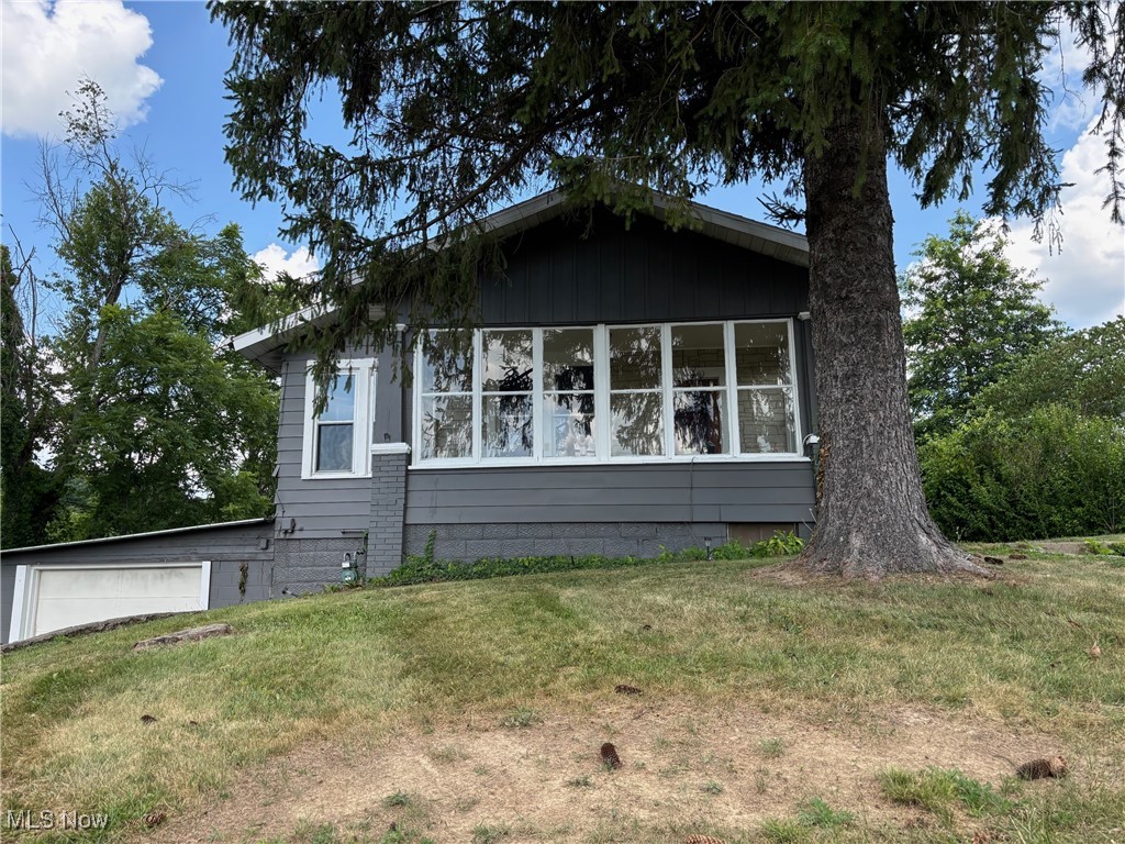 Looking for an investment? This property has long-term renters and they would like to stay. City property with lots of backyard space! Nice ranch home with 3 bedrooms and 1 bath. Attached garage with rubber roof. Inviting sunrooms on the front and back to catch the sunrise and sunsets.