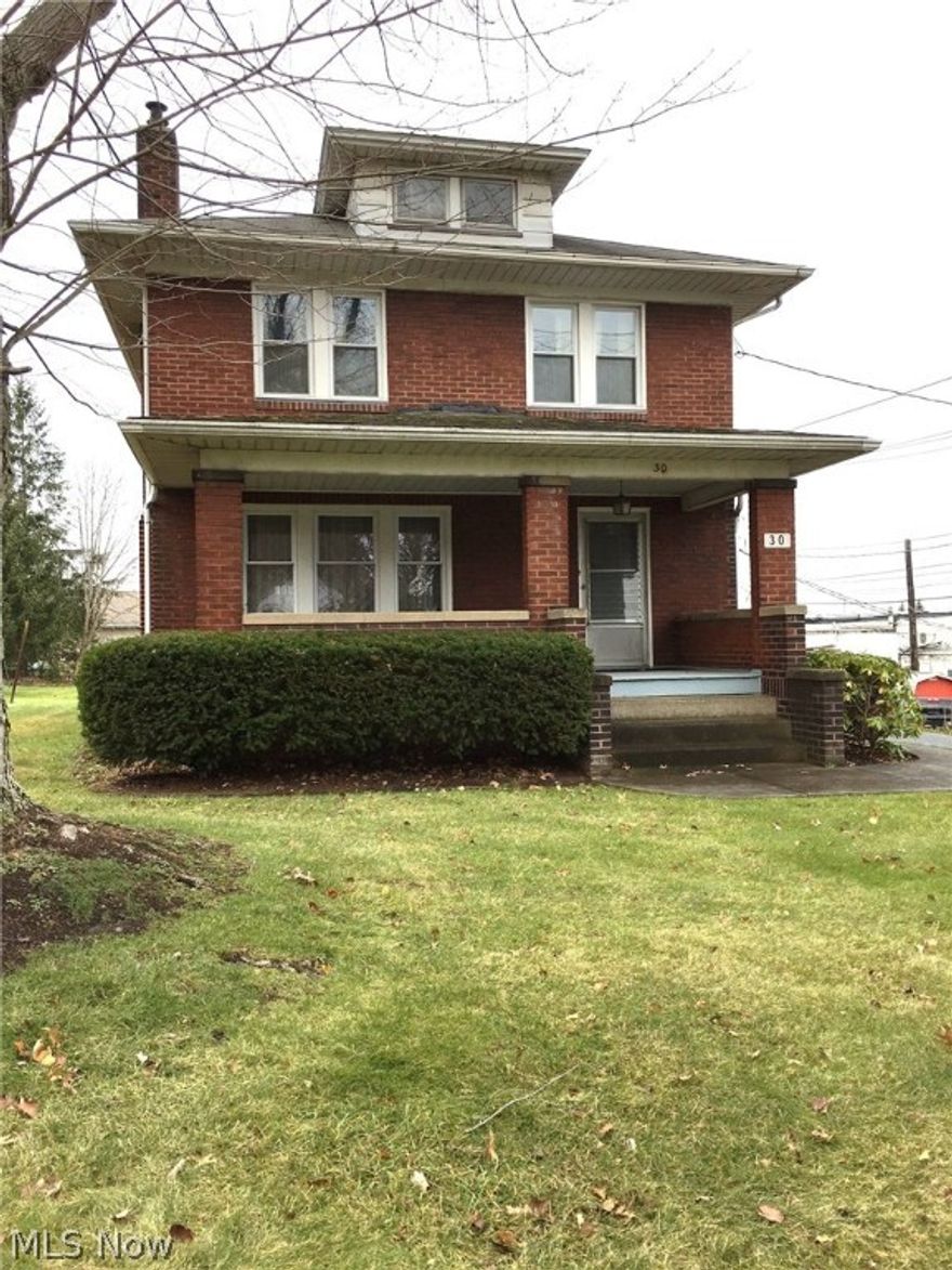 This brick two story has been carefully maintained and gently lived in by only one family.  Large covered front porch leads to front entry of an inviting large  foyer. Ample first floor rooms include a living room graced with a brick fireplace, large open formal dinning room, kitchen with separate dinette and ceramic tiled half bath complete the first floor. Four bedrooms up, full bath, built- in hall storage and hardwood floors (one exposed, remaining carpeted) finish the upstairs. Windows are newer, roof is approximately 10yrs old, detached garage has a newer overhead door. Wonderful possibilities for family living. Callnow for your showing.