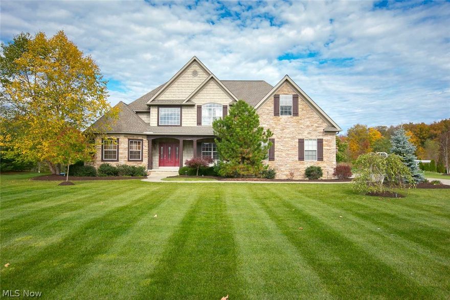 Stunning Colonial home in the highly coveted The Reserve at Kings Ridge subdivision w/ Highland Schools in Sharon township.        Originally used as a model home by Somerset Builders this homes boast many wonderful upgrades. Set on a sprawling 2.4 acre lot. Entering the Foyer you are greeted by 3/4 inch maple hardwood floors and a grand maple, wrought iron staircase. Make sure to check out the stunning 17 foot Coffer Ceilings in the Great Room. 
Gourmet kitchen w/ granite, custom maple cabinets. Eat in area as well as large pantry and butler/service station.
3 Bedrooms upstairs with 30 x 12 Loft and 2 full baths. 
New Carpet and paint throughout main and upper levels.
First floor master with luxury master bath. Bath includes a soak tub, double vanity and entry into the custom closet with beautiful built-ins. 
First floor laundry with built in maple cabinets and granite countered sink.
Finished basement with office, sound-system, and storage GALORE!                         A BEAU