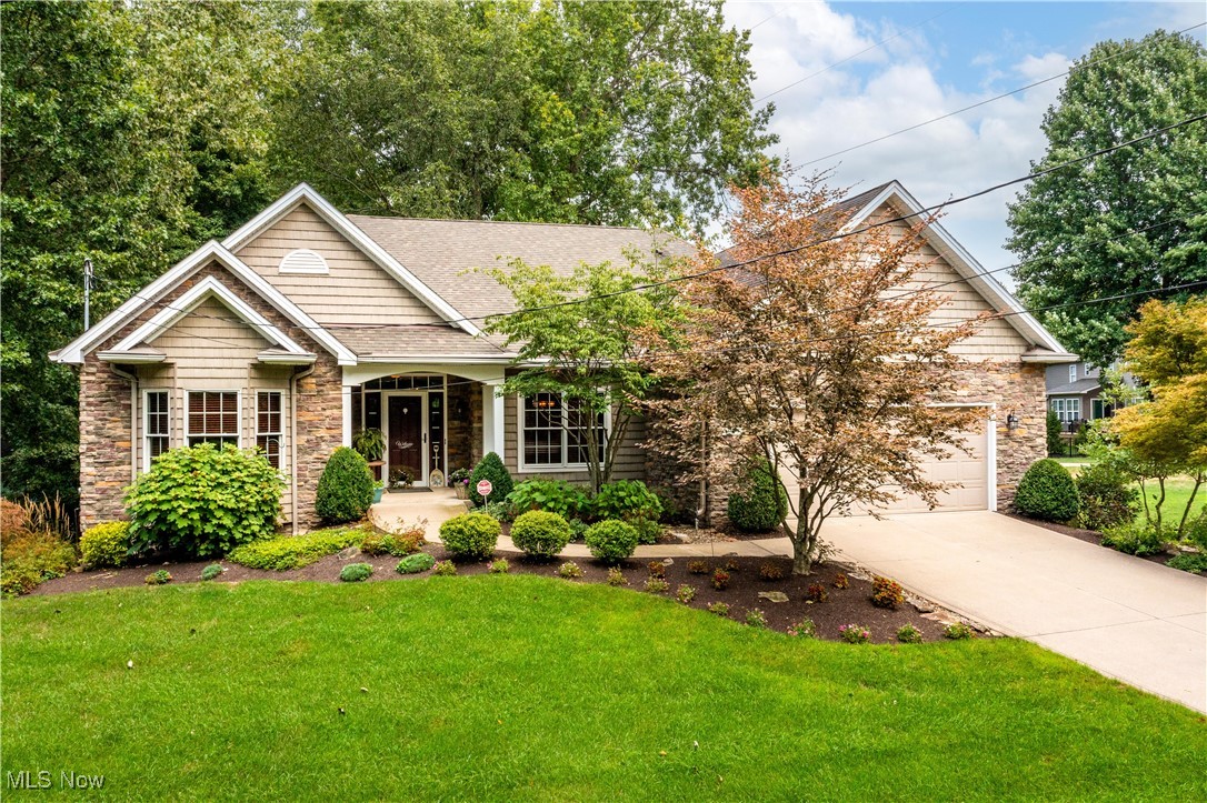 Welcome to this beautifully maintained raised-ranch 3-bedroom, 3-bath in Amherst Schools! Designed with accessibility in mind, it features wide hallways, no steps to enter, and a walk-in safety tub. The finished lower level has its own entrance, full bath, wet bar, oak cabinets, vinyl plank flooring, built in surround sound, plenty of storage, and a garage-perfect for an in-law suite or apartment.
The foyer opens to a library with custom cherry built-ins and Brazilian cherry hardwood floors. The living room offers a cozy gas fireplace, while the kitchen includes solid hickory cabinets, a flat-top electric stove, and a deck with a SunSetter awning overlooking the wooded half-acre lot.
The primary suite features 11 ft ceilings, dual closets, two linen closets, a shower, and walk-in safety tub. Extras include 9 ft ceilings, gutter helmets, 2-car garage plus side-entry garage, security system, and sprinkler system.
Updates: washer (2024), refrigerator (2024), stove/oven (2022), dishwasher (2016), dryer (2014), 80-gallon hot water tank (2021). Original furnace serviced twice yearly.
Close to downtown Amherst, I-90, local parks, and within Amherst School District! This home combines comfort, convenience, and versatility-offering all the space and features you've been looking for!