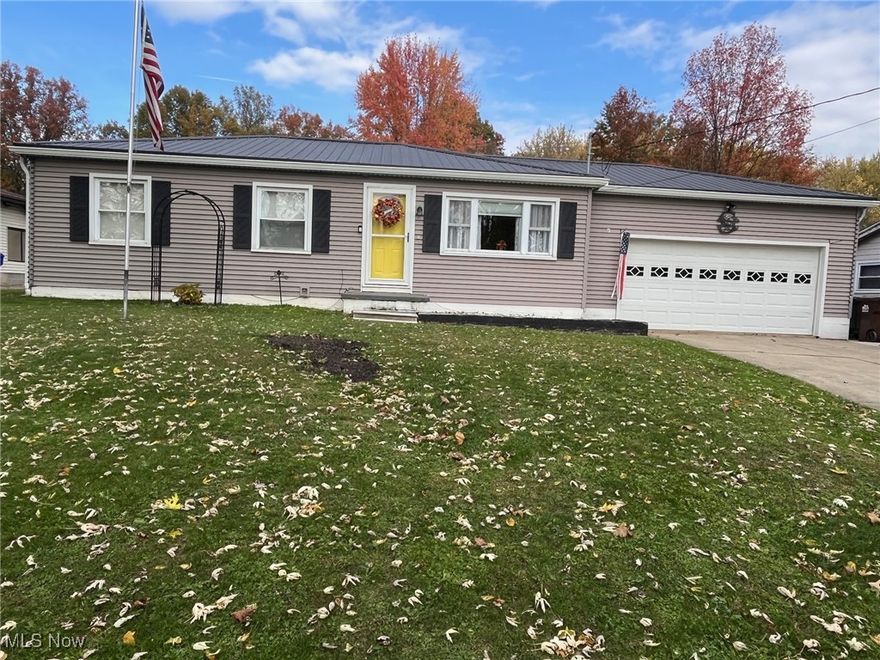 Ranch in Howland School District! Three bedrooms and two full baths.  This home is move in ready!  A very well maintained and updated home sits on .65 of an acre with a two car attached garage.  Walking into this home from the garage, you will enter the updated kitchen.  In the kitchen, walls have been removed, a breakfast bar with a butcher block top has been added, white crown moldings with new white cabinets and Corian countertops and pantry, new ceiling fan and light fixtures (the one closest to the stove changes colors), new island with storage with a butcher block top, and laminate flooring.  With the living room in sight, you'll never miss out! In the living room you will find the white molding that matches the kitchen with laminate flooring, new ceiling fan, new entry door with screen door and laminate flooring.  The three bedrooms have the natural wood flooring and have newer ceiling fans with light fixtures.  The master bedroom has two closets!  The full bathroom on main floor has been remodeled and updated.  The walk-in shower was done by Bath Fitter.  Basement is finished with a family room, full bathroom, a bonus room and a laundry room.  The updates include: Metal roof 2021, gutters 2023, Bath Fitter 2022, kitchen 2022, Furnace 2025, Flooring 2022, entry door and storm/screen doors, interior doors, breakfast bar, Light fixtures, garage door and opener.  The warranty for gutters and Bath Fitter will transfer to new buyer.  Call to schedule your private showing today!  This this a must see!