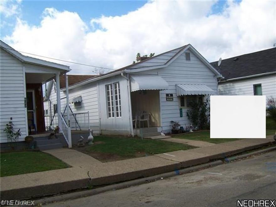 Now used as rental at $450.00 Mo,    Small covered front porch.  Newer furnace and gas hot water heater.  Washer and dryer hookup. Good home for the price.