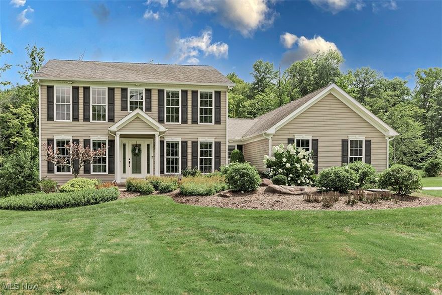 Stunning colonial in the Award-Winning Chagrin Falls School District - Set on a beautifully landscaped acre, this charming home offers timeless curb appeal and exceptional living space. Step inside to find gorgeous hardwood floors throughout the first floor, a private office with coffered ceiling and a formal dining room perfect for hosting w/ floor to ceiling windows. The open-concept design connects the family room with its elegant fireplace & built in seats w/ storage on either side, to the chef’s kitchen, complete with granite countertops, maple cabinetry, stainless steel appliances, refrigerator ('25) and sweeping backyard views. A convenient main-level laundry room and half bath add to the ease of daily living. On the 2nd floor, retreat to the spacious primary suite, freshly painted with walk-in closet and en-suite bath, while three additional bedrooms share a large hall bath. The incredible walkout lower level w/ brand new carpeting is designed for entertaining and relaxation, featuring a rec room, fitness area, mini kitchenette, full bathroom and access to the private, fenced backyard. A shed offers additional storage, and the professionally landscaped grounds create a serene setting. The 3 car attached garage provides ample space and storage. This move-in ready home blends elegance, comfort, and function—perfect for today’s lifestyle.
