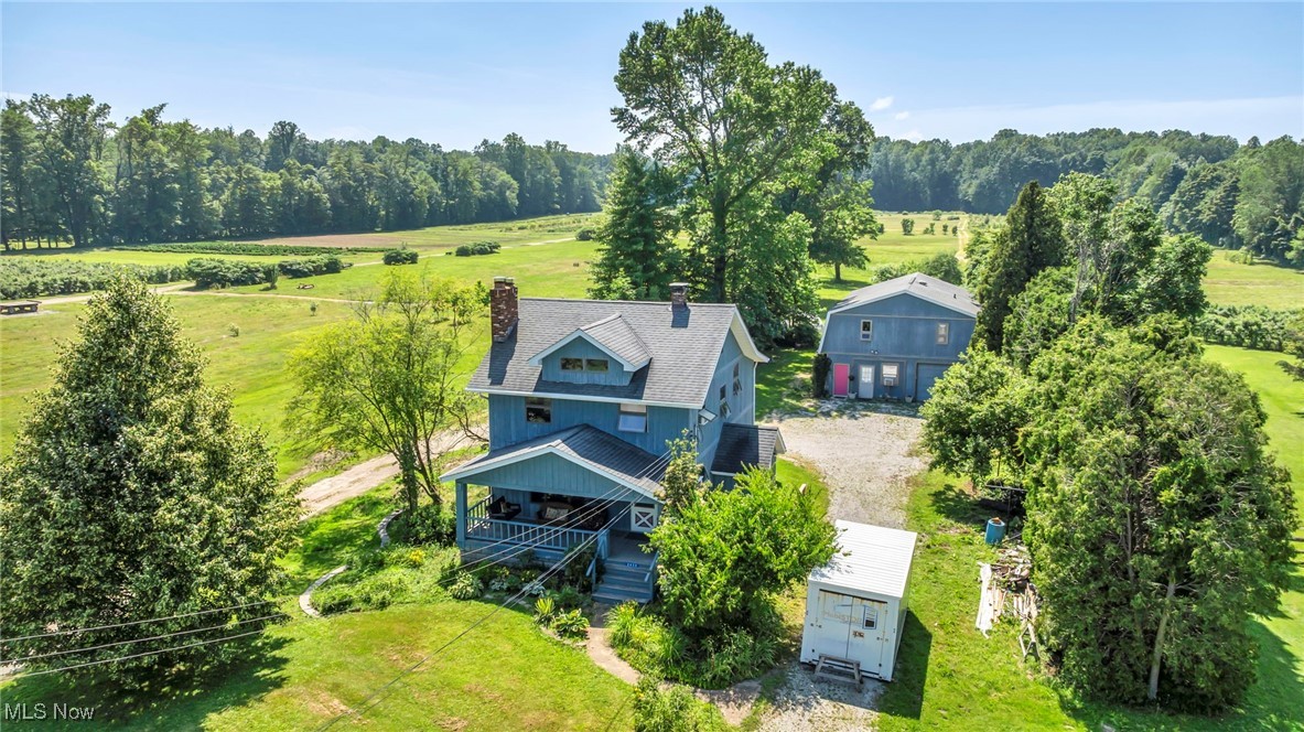 16-Acre Countryside Gem! Escape to 16 peaceful acres with a charming 1930s farmhouse and a 30x40 pole barn featuring a fully equipped efficiency suite. The pole barn offers plenty of room for ATVs, tractors, cars, boats, or RVs, plus a second floor for additional storage or workspace. A picturesque creek runs through the property, creating a serene setting ideal for gardening, homesteading, or relaxing in nature. Benefit from low agricultural taxes with transferable CAUV status, making long-term ownership affordable. With open fields and endless potential—this rare Madison property is perfect as a country retreat, hobby farm, or forever home. Just minutes from Lake Erie, local wineries, and all the charm of the area!