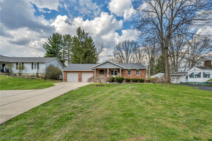 Very rare opportunity to own this beautifully updated 3-bedroom, 2-full-bath, all-brick ranch in the heart of Tallmadge sitting on almost 1 ACRE of land. The whole house was remodeled in 2020 top to bottom! As you arrive, you will be amazed by classic curb appeal and a welcoming front porch. Step inside to a bright and welcoming living room filled with natural light. The spacious eat-in kitchen features new cabinetry, modern countertops, stainless steel appliances, and plenty of counter and cabinet space perfect for everyday living and entertaining. The layout flows seamlessly into a stunning family room highlighted by a fireplace and large windows that bring in plenty of natural light. A full bathroom with a walk-in shower is conveniently located next to the family room. All 3 bedrooms are large with decent-sized closets. The second full bathroom is located in a hallway. The fully finished basement expands your living space and is ideal for a recreation room, home office, gym, or additional entertaining area. Take a step outside to enjoy the back porch overlooking a private, wooded setting, your own peaceful retreat. Attached Garage is oversized, with ultra-high ceilings! Concrete drive with a turnaround! Home was also waterproofed before the current seller bought it. The home is connected to city water inside, while the exterior uses a private well for outdoor use. Situated just minutes from the heart of Tallmadge Circle, this home offers convenient access to local favorites, including the Tallmadge Recreation Center, the Tallmadge Branch Library, and the charming Tallmadge Circle Park. Great school district and easy access to all major highways! Schedule your showing today!