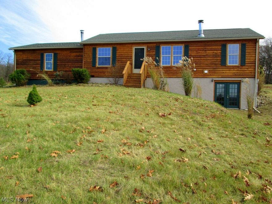 Would you like to sit high on a hill on almost 2 acres with a scenic view? This home is a TRUE MODULAR home so it can be financed using USDA financing ($0.00 down), FHA financing (3.5% down), or conventional financing. With a full price offer, the seller will pay up to $3,500 of buyer's closing costs. EVERYTHING has been done to this home in the last month: cedar exterior was cleaned, prepped, stained, and clear coated by professionals. Interior has new flooring, paint, and brand new refrigerator & range. Windows are Thermopane Energy Star compliant and walls of the home are 6 inches thick. Wood burning fireplace.