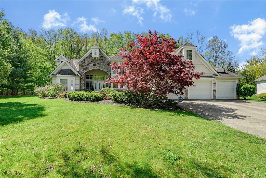 Welcome to this Custom Built Ranch featuring Great Room with Vaulted Ceilings, Stone Fireplace, High hat lighting, Large Beautiful Windows over looking 1/2 Acre Landscaped yard backing to Complete Privacy Wooded Area. Gourmet Kitchen with 13 feet of Granite Counter Tops plus 8 feet of additional cabinets added to original design. Breakfast Bar and Eating area in kitchen. Formal Dining Room with Spectacular Chandelier and 16 foot Ceilings plus Wall of Windows, Large Master Bedroom with Tray Ceiling, Stone Fireplace lead to Master Bath with oversized Jacuzzi type tub and shower, Double Bowl solid surface Vanity. Two more split Bedrooms and Full Bath, half bath off hallway entry. Huge Semi Finished Basement gives you an additional 2,363 sq ft for growing family. Alarm & Fire Systems, Sprinklers, Gutter Guards, on the cul-de-sac. Be the first one to see!