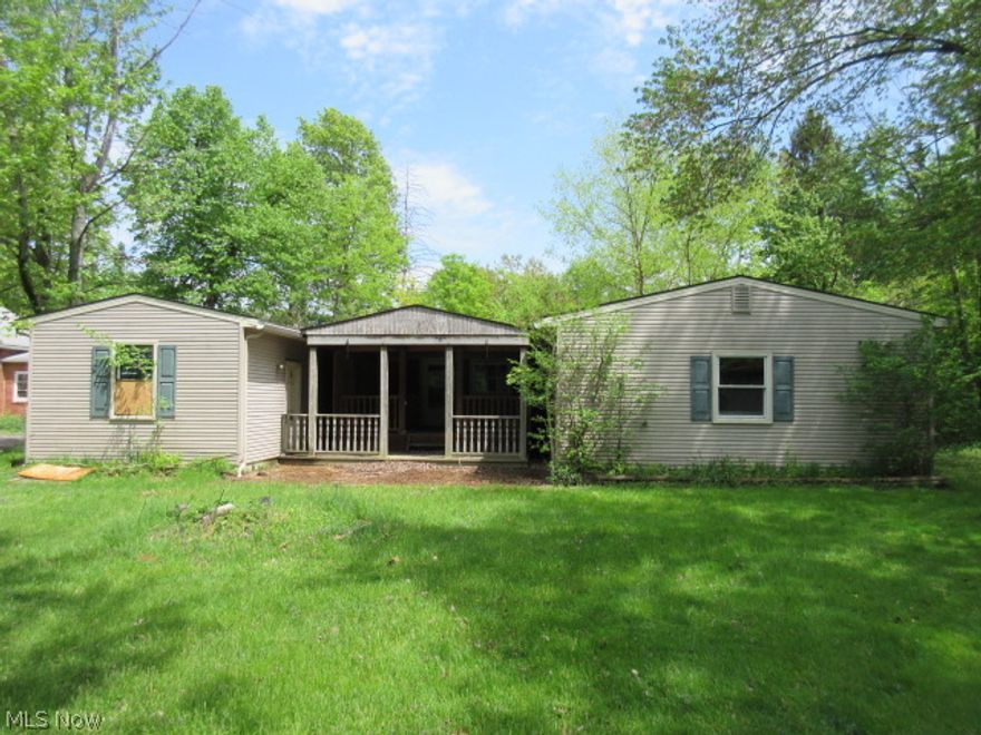 3 bedroom, 2 bath ranch home sitting on 2 acres of land. Large family room addition. Woodburning fireplace. In-law suite. Covered patio. 2 car detached garage. Part fenced yard. Needs some work, much potential here! Deep lot.