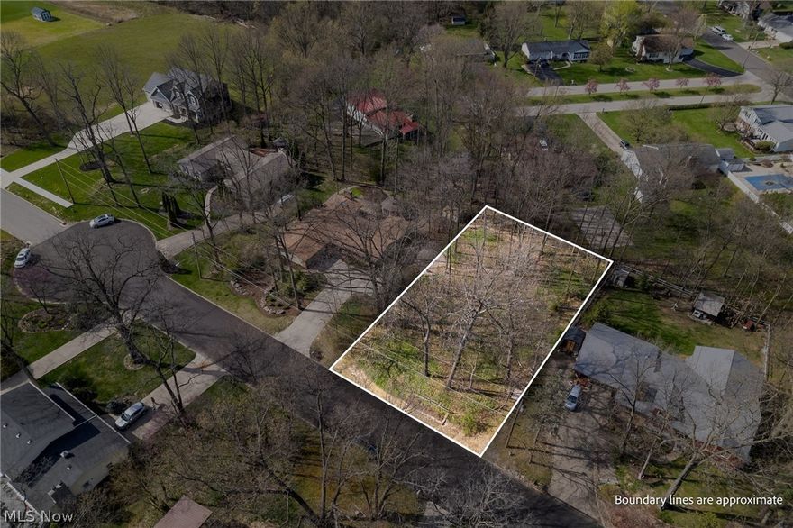 Wooded lot in Ashland City Schools!   This picturesque lot is located in an established neighborhood on a quiet dead-end street conveniently located off Mifflin Avenue.  Use your own builder to build your dream home on this lot with access to all the city utilities.