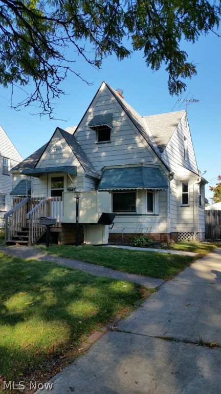 Contingent on short sale approval. Awesome home was in the family for 3 generations, now available to make your personal home or investment home! Architectural details are great from natural wood floors throughout to the built in wood cabinetry & arched openings, niche, curved ceiling to walls, smooth ceilings, dormers & roof lines! Great natural light in the neighborhood home only 1 block from Tuland Park. Foyer is accented with a newer front porch & has a handicap lift that can remain or be taken away based on need and want. 2 car detached garage has electric, lighting and opener for your convenience. Rear yard has wood fence for your privacy. Lots of storage with nice basement, dormer storage & cedar closet. There are 2 1st floor bedrooms & a large 2nd floor bedroom that has many uses & several closets that could be separate family or tenant space. Don't let this home pass you up, homes in the area are priced much higher & this home just needs some TLC to make it your home! Home has