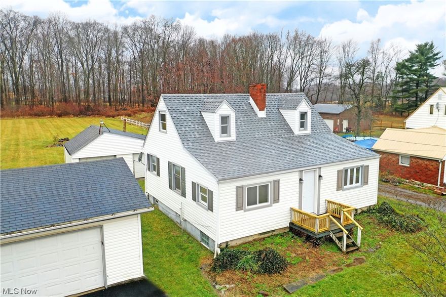 With its two floors of beautifully finished and freshly renovated living space, North Lima Cape Cod has all the right stuff! Move-in-ready and offering plenty of storage space with its three additional outbuildings, the attractive home stacks the deck in its favor. An expansive lot with a huge backyard adds to the allure. Inside, a gracious family room or parlor enjoys a large serving window looking into the nearby dining room as the soothing grey and white colors continue through each room, complimenting the natural-colored flooring below. Meanwhile the first-floor bedroom sits opposite the hall. Stylish lighting hangs overhead as you enjoy your meals. The sculpted entryway besets the impressive kitchen with its stone countertops, updated cabinetry and appliances. A charm packed full bath resides around the far corner. Finishing the floor, a spacious living room enjoys a central fireplace and ornate mantle. Carpeted stairs lead up to the pair of cozy loft bedrooms with their sloping ceilings. Joining them mid hall, a second full bath rounds things out. Laundry and storage can be found at the basement level.