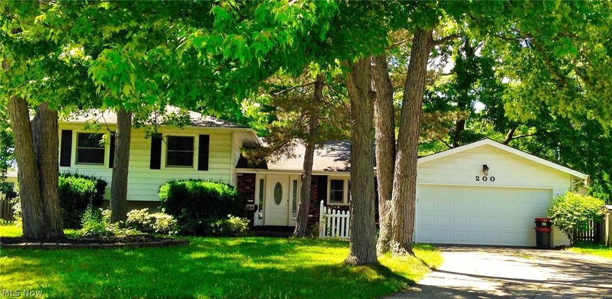 Immaculate Berea Split-Level with 2 FULL baths! You will love the curb appeal and first impression of this quiet, treed cul-de-sac lot. The white picket fence, brick front porch and newly replaced front door greet you with open arms.
The spacious L-shaped kitchen with newer flooring offers ample counter space! Ideal for buffet-style entertaining or space for your fresh baked cookies to cool! Or make yourself a coffee station and breakfast bar! The garage is conveniently located off the kitchen for easy grocery unloading. Gorgeous hardwood floors on the first-level living & dining rooms as well as all 4 freshly painted, neutral bedrooms on the 2nd level. Lower level family room has newer carpet, the 2nd full bath with shower, laundry/util. room and crawl space for additional storage.  The serene, fenced back yard offers ample room to toss a ball or have your pets play safely. Darling potting shed is great for the gardener in you! Overall the house is very neutral, but ready for your co