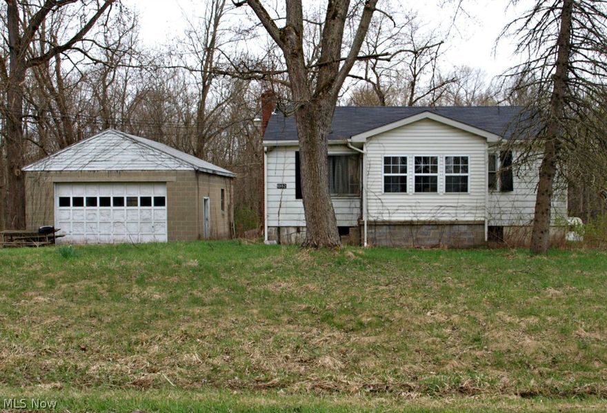 Here is a home in need of repair and cleaning out.  The property is very nice and peaceful with a little creek running along the side of it.  The home is being sold in "as is" condition with no guarantees of the condition.  Buyer will have to seek and discover any and all issues and repairs needed.  There is a nice two car detached garage.  This is being sold as a short sale, the process has been started and initiated by the bank.