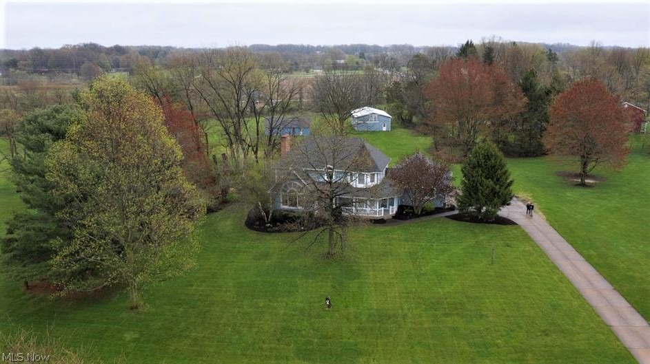 Perfectly perched on a 3.43 acre home site this quintessential Tobin built home is full of quality – style – flow and attention to detail throughout. A wrap-around porch opens to a center hallway & leads to the spacious formal dining and living rooms – into the open kitchen w/center movable island- topped w/butcher block- sunny dinette opens to the family room w/beamed ceiling- brick floor to ceiling FP surround w/built-in cabinets/shelving around the fireplace & leads into the striking 3 season sunroom w/rustic wood walls- vaulted ceiling /skylights/electric baseboard heating/custom brick floor& ceiling fan w/light - exits to the deck- all with a view of the stunning back vista including the two sizable Barns! A laundry and powder room completes the 1st floor. Upstairs houses the huge owner’s suite with 3 additional bedrooms & full bath. The lower level has a part finished area and ample storage. The freshly updated landscaping package perfectly complements the stylish home’s exterio