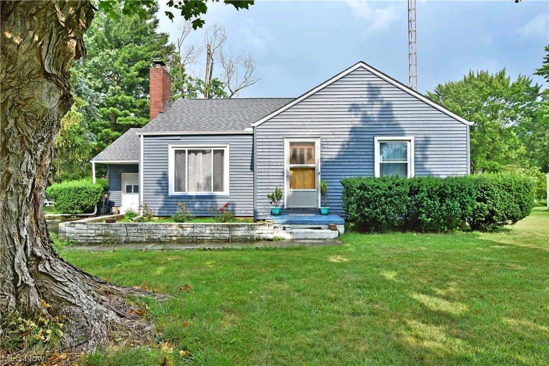 Complete with two floors of finished living space wrapped up in an attractive package, this colorful Warren residence has all the right stuff! The endearing residence packs plenty of charm and curb appeal alike as its handsome exterior is trimmed in thoughtful landscaping. The sizeable yard is easily enjoyed from a raised wooden deck, overlooking the bonus storage shed. A single car garage awaits the end of a blacktop drive while a bright blue porch accents the warm wood entry door. Like styled hardwoods fill the spacious living room as sunshine is cast across the fireplace from the large picture window. A sculpted archway leads into the central dining room, complete with rear patio access. Nearby, the welcoming kitchen includes a unique, stainless trimmed range for easy cleanup. A tiled backsplash runs beneath an array of cabinets nearby. At the main hall, additional built-in cabinet space divides the pair of relaxing bedrooms as they join a brightly lit full bath. Down below, the fin