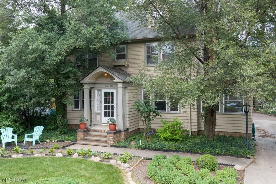 Quintessentially the most charming home ever.  This colonial (with a true cottage feel) has the most fantastic landscaped backyard.  
The formal living room with fireplace leads to a family room as well as a screen room.  The dining room leads to the kitchen (with a retro appeal).  
There are 3 bedrooms and one full bath on the second floor.  Bedroom #3 has a wonderful wood planked ceiling.  The third floor offers an additional bedroom and a loft area.  Full basement is available for storage, workout room, etc.
The backyard has a multitude of areas to relax in.  The landscaping provides the most private setting.
This home is in Cleveland (hence very low taxes) and Shaker School District.
Come see this romantic property!