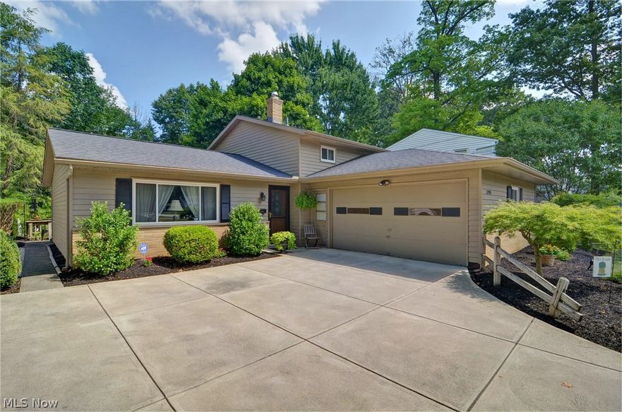 This striking home personifies comfort, convenience and pride in ownership. Situated on a beautifully landscaped lot with low maintenance gardens, paved accents and an inviting deck… it’s ideal for everyday living, and, entertaining with family and friends. The interior layout is open and airy with vaulted ceilings in the living and dining rooms, an L-shaped kitchen with direct access to the private outdoor living space, a large family room with the added warmth of a gas fireplace and dry bar, spacious laundry/utility room which leads to an attached 2 car garage, tucked-away guest bath, plus 3 bedrooms and full bath on the second floor. Transitionally styled, this well maintained home boasts approximately 1800sf and is equipped with a forced air heating system, central air conditioning, newer windows (2013), newer asphalt shingle roof (2010), and newer concrete drive (2011). Enjoy easy access to downtown Cleveland and Hopkins Airport, plus minutes to parks, shopping, restaurants, schoo