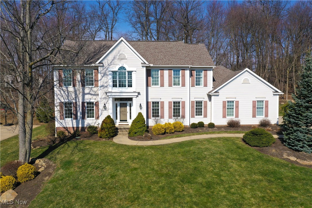 Exceptional classic colonial in desirable Kingsbury Trace presents spacious living areas, sweeping ceilings, and superb appointments and design throughout. Gracious foyer w/transom entry highlights new hickory floors and an open turned staircase. Formal dining room and office/living room features crown molding and abundance of sun filled light. Fabulous updated kitchen is a chef's delight and offers multiple palladian windows, SS appliances including double oven, granite countertops, tile backsplash, new lighting, island/breakfast bar, and coffee/wine bar w/beverage cooler. Separate eating area with access to expansive composite deck. Engaging great room highlights vaulted ceiling, hickory flooring, stone gas fireplace w/raised hearth, and walls of glass w/transoms overlooking the landscaped yard. Adjacent guest bath and laundry room w/built-in cubbies conveniently located. Glass French door to private office completes the first floor. The second level hosts four bedrooms including the owners suite.
The luxurious owners suite boasts vaulted ceiling, walk-in closet, and newer 16' x 11' glamour bath with soaking tub, walk-in shower, and h/h vanity sink. An additional three bedrooms, one ensuite, and newly remodeled main full bath w/skylight complete the second level. Full basement ready for finishing to the buyer's discretion. 3 car side load garage. Wooded backdrop and perennial gardens. HVAC and April Air '22. Large deck overlooks yard and woods. Additional notable updates include electrical, hardwood floors, lighting, painting, and much more. Turnkey!