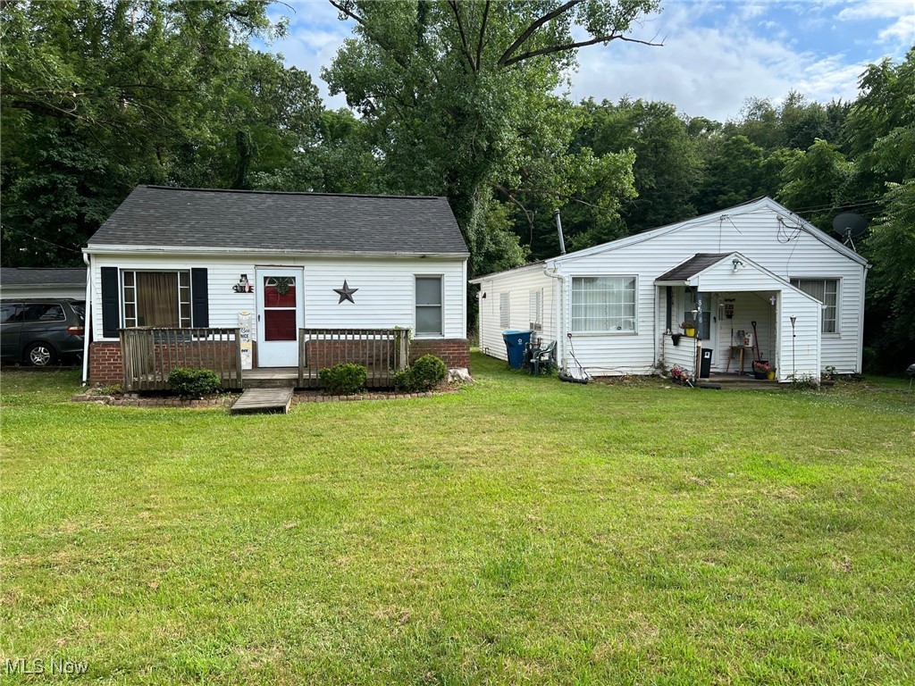 Awesome investment opportunity with this 2 separate houses, 2 unit. Right across street from long lake in Portage Lakes. Currently is Tenant occupied and are paying 850 and 800. The 800 is section 8. Off street parking and the one property has a garage.
