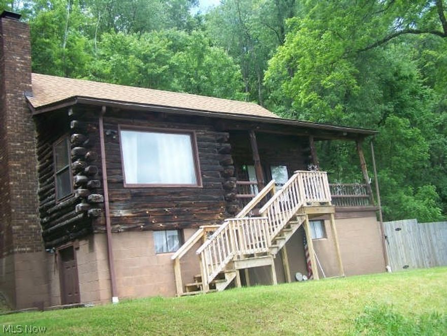This LOG home is located in a very quiet neighborhood, that shows pride of ownership, over looks the town and you can see Ohio river from front porch
home features bedroom on first floor, Large living room with a lovely stone fire place, private fence, 2 porches, side and front porch. property has 2.58 acres, mineral rights do not go with he sale of the home.  Call for a showing.