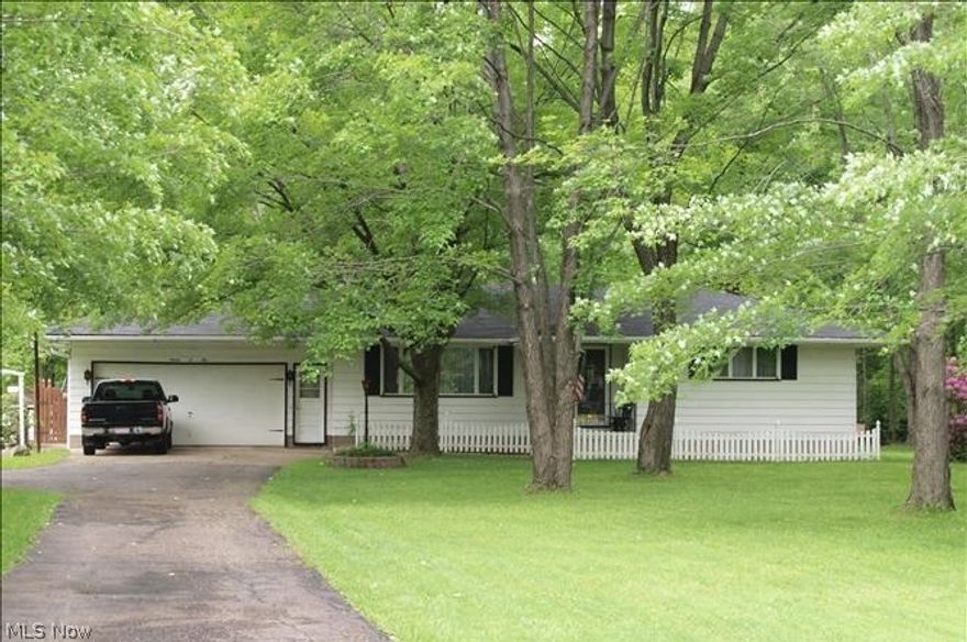 Beautiful mostly wooded 5.3 acres 164 x 1221. 3 bedrooms, 1 1/2 baths, livingroom, dining room, large basement, 12x14 shed/outbuilding. Recent updates: Furnace & AC 2002, Roof & Gutters 2010, Outbuilding Roof 2010, Garage Door 2010, Hot Water Tank 2013, Sub pump #1 2012, Sub pump #2 2013, basement waterproof 2006, glass block windows 2002, kitchen Kraftmade 2005, bathroom 2012, driveway 2013.
