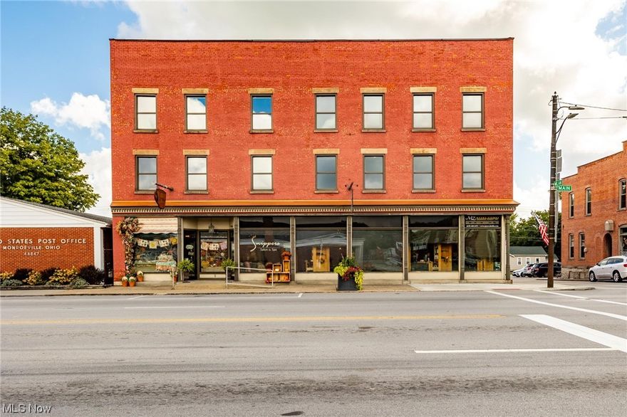 Step into the past and embrace the future in this beautifully restored 1840s downtown commercial building. Admire the meticulously preserved original tin ceilings that adorn the space, perfectly complemented by new windows and doors that flood the area with natural light. Walk on stamped and stained concrete floors with radiant heat via a zoned boiler system, ensuring year-round comfort.

Situated on a corner lot, this property offers the convenience of off-street parking and features both front and rear entrances, complete with common areas and restrooms. Currently housing three long-term tenants - a cozy coffee shop, a stylish salon, and a reputable insurance company.

Yet, the story doesn't end here. The second and third floors present exciting opportunities for further development. Picture offices, loft apartments, or unique boutiques, all while preserving the building's timeless character. Act now and grab what could be the most gorgeous commercial building in the area.