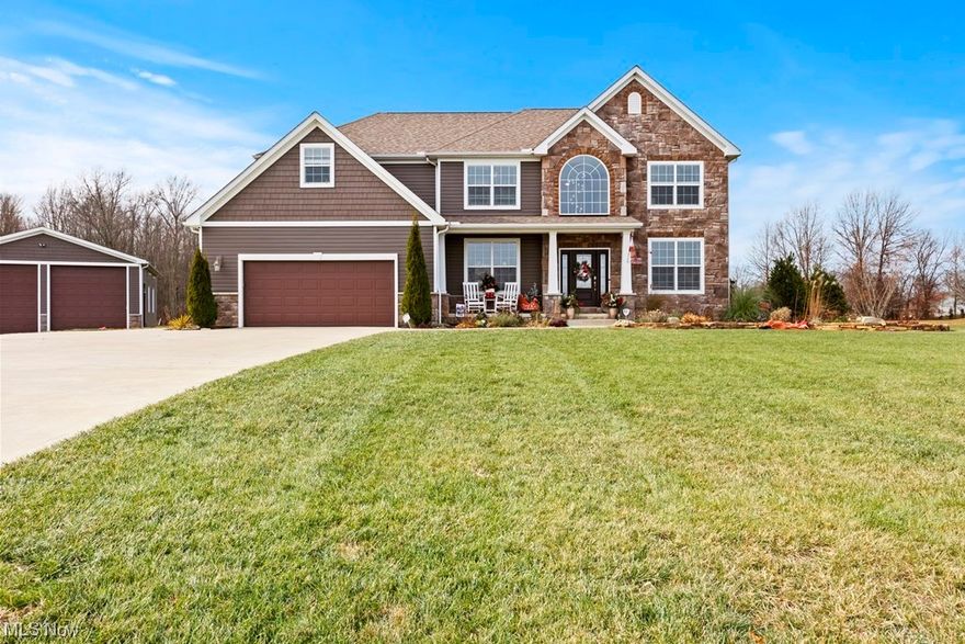 Located in the Ravines Edge subdivision this custom built colonial style home is over 3000 sqft. The kitchen is a chef's dream with granite tops, an island, ceramic backsplash,  all stainless appliances including a trash compactor and a 6'x9' walk in pantry. The first floor has a huge great room with a fireplace, living room and a formal dining room. The second floor features a laundry room, 4 bedrooms including an owners suite with an ensuite bath with loads of ceramic tile, huge multi-head shower, garden tub, dual sinks with granite tops, two large walk in closets and a tray ceiling. Full basement with lots of room for additional living space if needed.  Carrier high efficient gas furnace and a tankless hot water unit. Inground swimming pool was new last year! Unbelievable covered patio area with stamped concrete, fireplace, bar, outdoor kitchen, ceiling fans and a large screen TV. There is a 30x40 pole barn with concrete floor, 100amp electrical service and a wood burning stove. Less than 2 miles to 10/480 and in the Keystone School District.    Call for your tour of this well designed custom home.