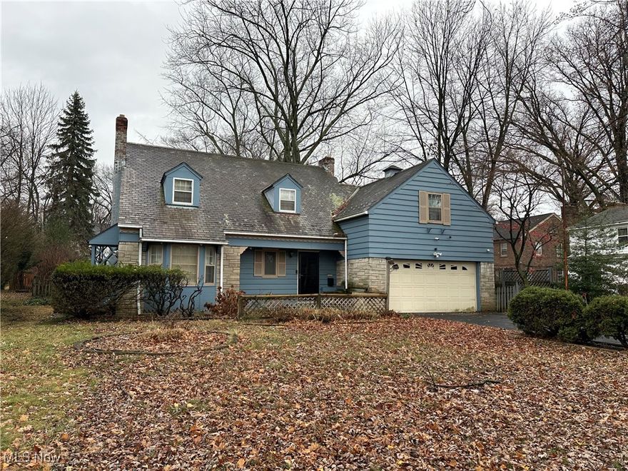 Lovely 3 Bedroom 1.2 Bath 1865 sq ft Cape Cod located close to the Cleveland Heights border near the Forest Hill Historic District. It has a covered front porch, spacious rooms, great floor plan, a slate roof, a 2-car attached frontfacing garage, hardwood floors, central air, a tiled foyer with coat closet, an eat-in kitchen, 1st floor half bath, formal living room and dining room that are open to one another, a rear screened covered patio accessible from the formal living room, and a partially finished basement with a half bath, a wood-paneled recreation room with wood-burning fireplace, laundry room with sump pump, a tool room and the utility room. The dining room has two arched built-ins for displaying your favorite decor. The living room has a wood-burning fireplace with an arched built-in to the right with open storage for showcasing your treasured collectibles and decor, or books and photos. The closed storage is great for storing games or other things you don't want visible. Upstairs you will find plenty of storage, three (3) spacious bedrooms, a main bath with an updated shower and a bonus room that could either be used as an additional closet, an office, or be converted to either a 2nd bathroom or a laundry room. The furnace and central air were replaced in the last 5 years. The hot water tank is about 3 years old. All the windows on the first floor have been replaced and all the windows on the 2nd floor -- back of the house only -- have been replaced. Fully fenced rear yard (wood) with patio; garage has electric, water, drain, garage door opener; 
kitchen has instant hot water system, electric range, dishwasher. The home's spacious rooms and great floor plan offer endless possibilities for customization, allowing you to create your dream home!