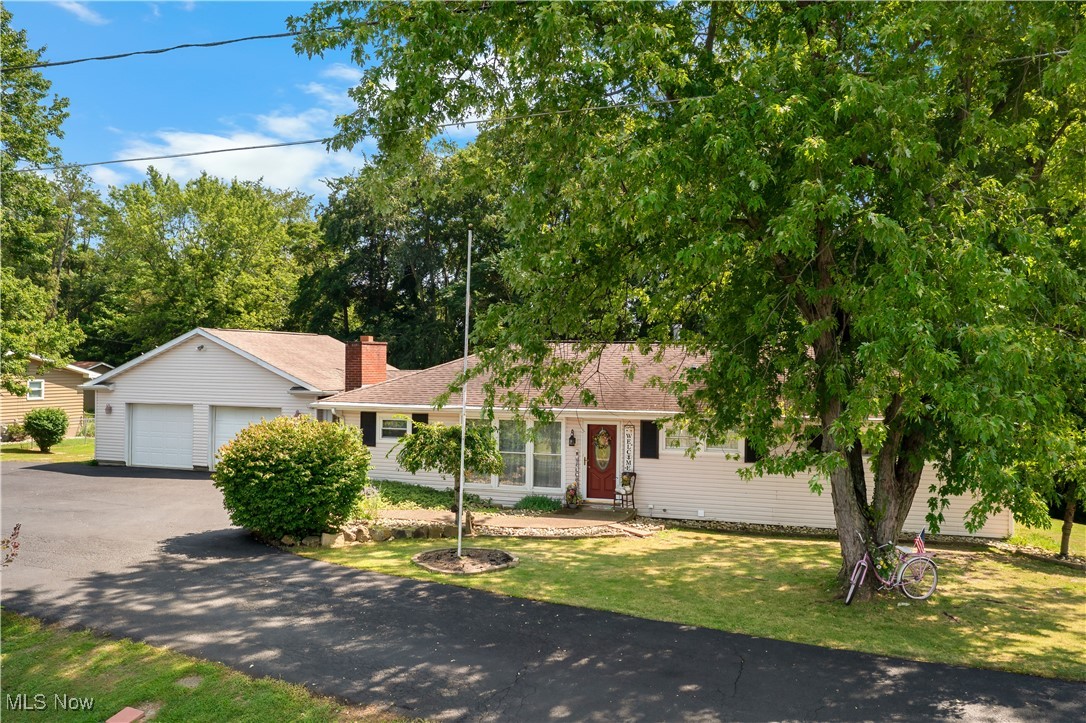 Offering one-floor living and a warm, welcoming feel, this 2-bedroom, 2-bath home is full of practical updates and charming details—just minutes from East Muskingum Schools, Muskingum University, and downtown New Concord. From the oversized 2-car garage with workshop space to the inviting interior layout, this home balances comfort, space, and everyday function.
The eat-in kitchen features recessed lighting and flows easily into the living areas, making daily routines or entertaining a breeze. A breezeway connects the garage to the house and includes double doors on both sides, allowing you to close out the elements when needed while still enjoying the space as a transitional entry or bonus sitting area. The front living room includes a cozy fireplace insert with stone hearth and mantel, while a larger family room at the back of the home overlooks the yard—creating a quiet, relaxing space to unwind or host gatherings. First-floor laundry brings added convenience.
Downstairs, a finished room in the basement has been used as a third bedroom and could also serve as an office, playroom, or hobby area. The basement is already equipped with plumbing and fixtures in place to install a third bathroom if desired and much more area to create bonus living spaces, hang out spaces, workshops, or storage. The blacktop driveway and additional parking area add ease, and the 0.58-acre lot gives you a good-sized yard to enjoy.
Out back, a large deck wraps around the rear of the home and provides the perfect spot for summer barbecues, quiet mornings, or evening sunsets. Several recent improvements—including a new septic system and furnace, newer water heater, and AC only 6 years old. To add even more value to your home foam board insulation has been added to insulate the foundation and multiple inches of blown in insulation have been added to the attic.
Schedule your private showing today and see how this comfortable home with room to personalize fits your needs.