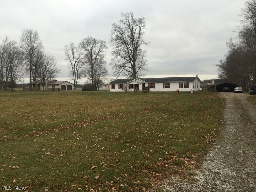 Come see this spacious 4 Bedroom, 2 Bath, 2280 sq ft Manufactured home set on a crawl space approximately 125 ft back from the road on 2 open acres outside of Fredericktown. It is approximately ¾ mile from SR 13. There is a 20x20 carport, 12x16 shed, outdoor wood-burner, front porch, and back deck. This country home features an extra-large family room with wood burning fireplace, large pantry in kitchen, lots of storage, two closets in master bedroom, and garden tub with separate shower in master bathroom. Newer washer, dryer, refrigerator, stove, dishwasher, and microwave with warranties from Lowe’s through August 2017 which will transfer to the new owner. Property has access to Time Warner Cable with High Speed Internet. The chest freezer does not convey. TV in master bedroom does not convey, but wall mount will stay. $99,900