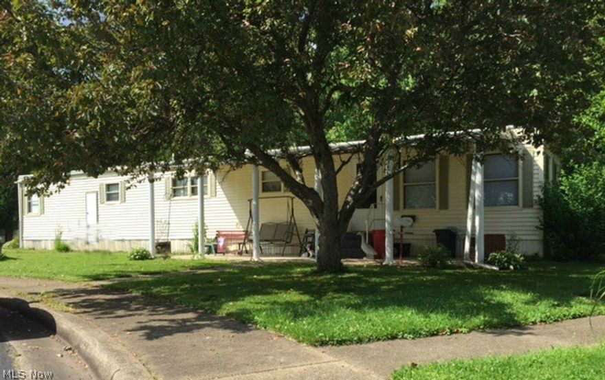 Cozy home with many updates! Great private back yard with partial fence, shade trees, wooded in the back and screened in sun porch. Newer carpet and laminate floors in kitchen. Updated plumbing. Hot water tank 2014, fresh paint and roof coating done 2014. Shed with electricity.