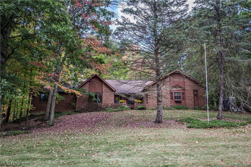 Welcome to the Barclay neighborhood of Walton Hills. Tucked back beneath the privacy and tree canopy of mature trees stands this spacious  ranch on nearly an acre of land. Pass through the courtyard and enter the foyer where you will find vaulted ceilings, a stone fireplace, open layout kitchen with eat in banquet, formal dining or a wonderful office space and walk out deck purveying all the glory of this wooded lot! Book your tour today and see how sweet life can be on Rashell Drive!