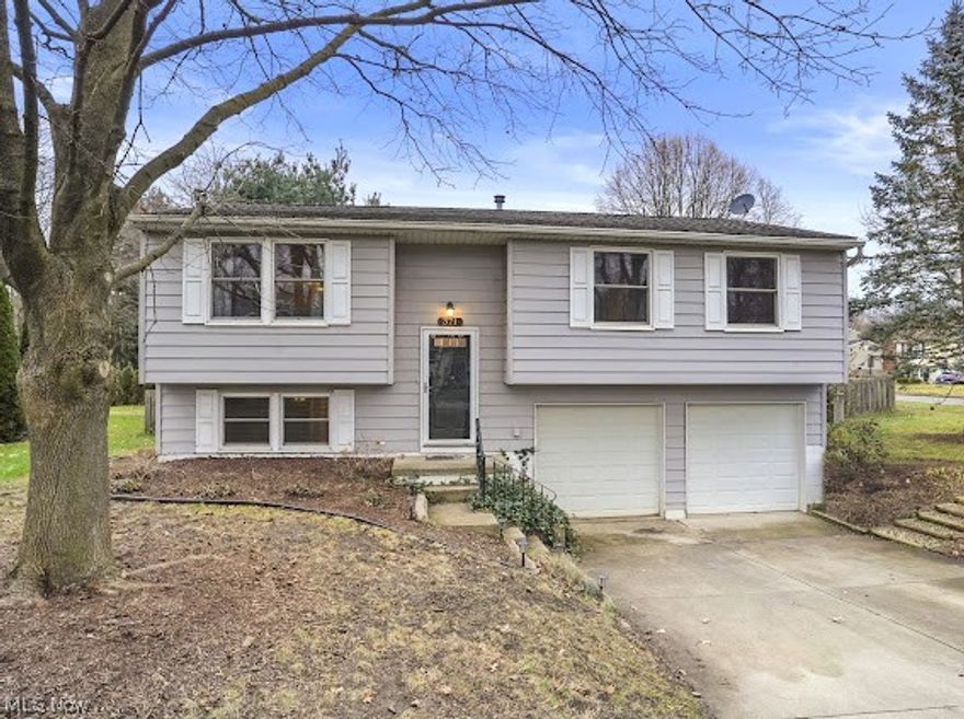 371 Michaels Drive, Kent --- this 4 bed/2 full bath property turn-key property is move-in ready! Inviting 2-story flyer. Open floor-plan with a spacious main living area. Completely updated (2019) bright white eat-in kitchen, subway tile backsplash, tile flooring, peninsula & stainless steel appliances. Dining area leading out to the back deck and fenced in backyard. Three bedrooms are down the hall next to the newly updated (2023) bathroom including new vanity, tile flooring + tub/shower surround. Lower level is accessible to the 2-car attached garage & another bedroom w/ a walk-in closet or even an additional entertainment area + a full bathroom. Laundry area with washer and dryer are included + a wash tub sink. Other updates include carpet (2018), HWT (2018), A/C unit (2019), stainless steel appliances (2020). Paved Driveway, Storage Shed, beautiful high-end low maintenance landscapes including natural pollinator flowers, grasses, and perennials in the flower beds. There are well established raspberry bushes, strawberry plants and lavender + chives that come back year after year! Kent Local Schools. Desirable Location. Tucked away in a neighborhood, yet in close proximity to all amenities such as Downtown Kent, KSU, NeoMed, Restaurants, Shopping and more! Your opportunity to OWN this immaculate property is NOW!