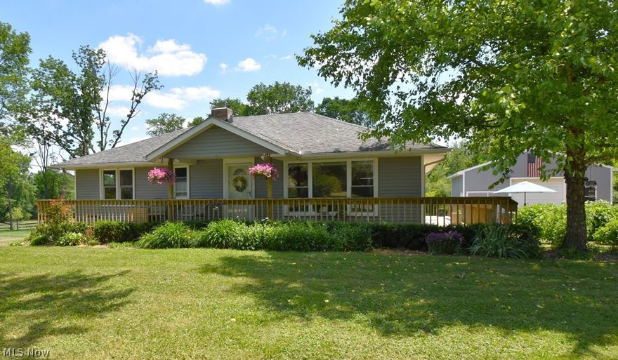 Here is your chance to own a ranch on almost an acre in the Solon School district!  Quaint three bedroom ranch flowing with nice oak flooring has so much potential!  Hang out downstairs in the recreation room that boasts a wet bar and play pool or watch the latest game  Laundry area also has a unique carpenter tool bench.  Lots of extra space for storage as well.  The large barn/garage is a dream come true for the car or wood worker buff.  Heated by either propane or a wood burner.  12 ft 2 post 7000 lb capacity lift is negotiable.   Ohio State Waterproofing warranty will convey with the sale and continue with a small annual fee.  Furnace/AC is 3 years old, Sump pump 2019, water heater 2011,