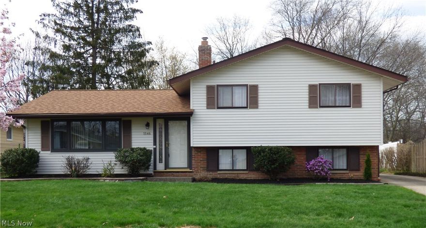 Pride of ownership! Delightful 3 bedrm 2 full bath split level!  Sellers have one of the largest yards in the neighborhood...must see to appreciate! 
A beamed cathedral ceiling and sunny picture window accent the comfortable living room and dining area with newer flooring and neutral décor.  A sliding glass door leads to the large back yard, ideal for play or gardening!  The accommodating kitchen has newer cabinetry and appliances.  Steps away, the lower level recreation room has a cedar closet, full bath and walk out access to the yard.  The laundry is found here with a newer washer and dryer, included!  
Upstairs, 3 bedrooms (one with hardwood flooring) share the lovely updated bath. Roof replaced by owners.  Great location, close to stores, highways, downtown, schools, hospitals!   Clean and ready for new buyers!  2 car detached garage.  Show and sell!