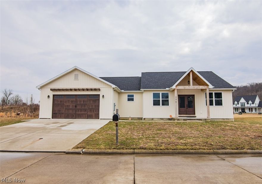 Welcome to effortless, one-level living in this stunning 2023-built ranch home. Offering 3 bedrooms, 2 full baths, office, 2 car attached garage, central vac, laundry room and more! Step inside and you’ll immediately notice the 9-foot ceilings throughout & impressive living room with cathedral ceiling that creates an open, airy feel throughout. The heart of the home features beautiful granite countertops, modern finishes, and an open layout ideal for entertaining. The primary suite is designed for relaxation, complete with a tray ceiling, large walk-in closet and a spa-inspired bath retreat. A dedicated private office provides a quiet, professional workspace, while the spacious laundry room with utility sink adds practical luxury. Enjoy peaceful surroundings close to the golf course while still being conveniently located near shopping, dining, and major travel routes. Whether you're upsizing, downsizing, or looking for low-maintenance luxury living — this home checks every box. Perfectly positioned beside Woodridge Golf Course and just minutes from I-77 for an easy commute!