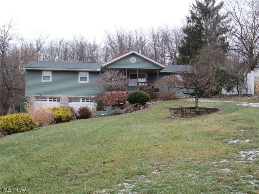 All new floor coverings. New bathroom vanities and sinks. New paint through out house. Large eat in kitchen with oak cabinets, formal living room, large family room up and large family room in basement. Sprawling back deck with most of it covered over looking a park like sitting with wooded area behind house. Has a large covered front porch to relax and enjoy the professional landscaping all around. Newer vinyl siding, windows , carpet, garage doors ,TRANE electric heat pump with AC, all updated duct work . Remote thermostat for AC/Heat . You can adjust your heating or cooling from your smart phone prior to arriving home plus many other special features. There is a 1 yr. Warranty left on this thermostat . Will transfer to new owner . Large 2 car attached garage with built in cabinets. New water line installed in September of 2016.