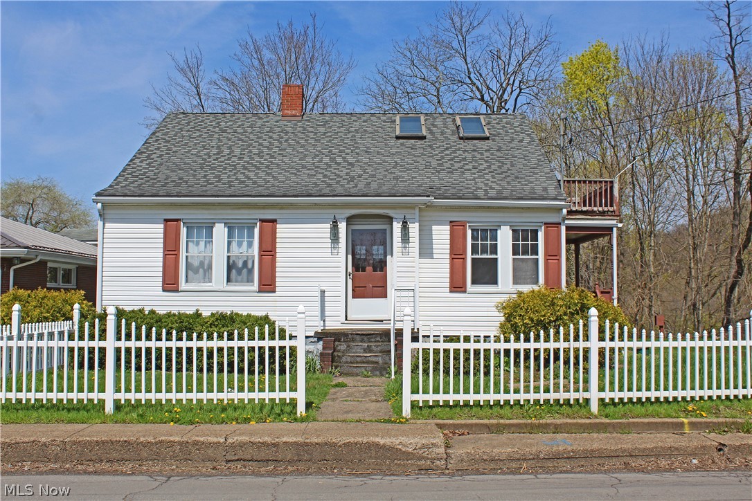 Charming, spacious, and affordable! Come home to this darling three bedroom, three bath Cape Cod. Features include: wood floors, skylights, large master bedroom with walk-in closet, and huge master bathroom. Situated on two level lots with a detached 2 car garage. Call today!