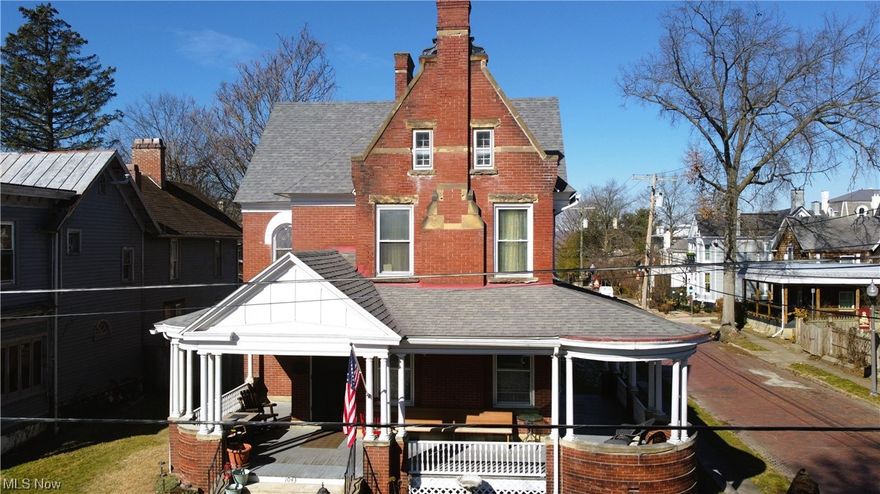 This striking work of art was built in 1890 and is a central feature in West Virgina's largest and most prestigious Historic District - Julia-Ann Square in Parkersburg, WV. You will be easily swept away by the nexus of livability and grandeur of the finest architectural elegance of the time - easily translating to our 21st century wonder that only a classic Victorian home can deliver. This spectacle of human achievement has some of the most stunning and ornate fireplaces found among the stalwarts of the historic district. In beauty, these may only be eclipsed by the Tifffany stained-glass windows that bathe the magnificent, formal entry. Marvel at the original, beautifully-patterned solid oak flooring throughout. The main floor rooms flow gracefully from one to another with arched passages, built-in book cases, and awe-inspiring wood work from a time in American history we will never get back. Functionally, the home has a completely modern electrical system, a beautiful modern kitchen - with new stainless steel appliances, three floors of modern, central multi-zone heating and cooling. This home comes with a lengthy list of recently completed work - all for you, the next caretaker of this sensational home. Spread out a little, as the home comes with two lots and sleep well with a seller-provided ONE-YEAR HOME WARRANTY.