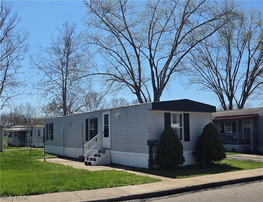 This lovely, updated little home could be your perfect sanctuary. With two Bedrooms, one Bathroom, and an open Living Room and Kitchen, it's just the right amount of space. The Bedrooms both have nice sized closets, and the full Bathroom has a newer tub surround. The Kitchen comes equipped with a newer Range, Refrigerator, and Microwave, and has a breakfast bar for meals. The Laundry area, separated by a trendy partition, comes complete with the Washer & Dryer! There's a small patio at the front door that is the perfect spot for your outdoor furniture and plants. Out back, right off the driveway, is a small deck that leads into the kitchen for easy access with groceries. The yard has a gravel pad with a small shed on it for storage. There is also a small garden patch at the end of this home, a perfectly manageable size for your fresh, summer veggies. Updates completed over the past two years are: paint, flooring, appliances, bathroom counter, closet doors, front door, door hardware, shutters, roof, some exterior paint, and shed.