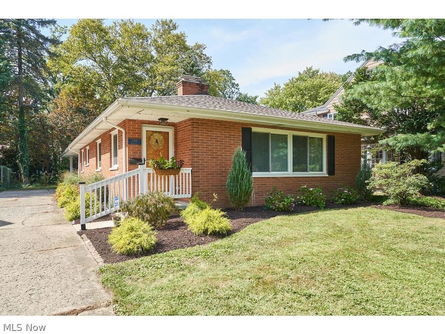 RARE move-in ready 2 BR 2 BA brick Ranch w/2 car attached garage in west Akron’s desirable Castle Park neighborhood that is packed charm! Main floor features a spacious front living room with stately brick corner fireplace open to dining area, plus a large newly updated kitchen with granite countertops, stainless steel appliances & breakfast bar, 2 generous sized bedrooms with hardwood floors & updated full bath. This home also hosts a waterproofed partially finished basement featuring a den that has an add’l fireplace, add’l office/BR, full bath & lots of storage! Major updates include windows throughout and glass block in basement, roof & gutters, A/C (did not have prior), front & back storm doors, back door, and new concrete/brick front stoop and railing! Conveniently located less than a 5-minute drive from Portage Country Club, Hardesty Park, both Wallhaven and Highland SQ shopping & dining, and I-77!