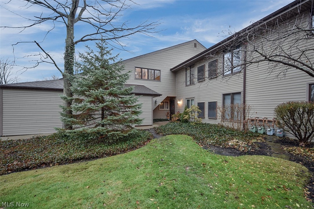 Upper floor unit in the desirable Trees Condominiums. This 2 bedroom, 2 bathroom unit has a private balcony that overlooks the tranquil wooded setting. The kitchen has stainless steel appliances and a custom built-in desk/work area. The large living room has plenty of space to entertain family and friends, with glass sliders that open to the balcony. The master bedroom with ensuite bath includes 2 closets and also opens to the balcony. The attached garage offers extra storage space with cabinets and a loft. This hidden gem is just minutes to Chagrin Falls Village, shopping, restaurants, parks, and highways.