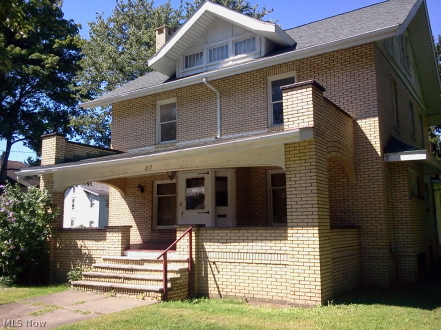 Large, 4-bedroom, brick home featuring beautiful wood trim, wood built-ins, & exquisite glass appointed hardwood doors.  With new kitchen appliances, this home has it's original charm awaiting a special owner to appreciate the possibilities.  Additional space in 3rd floor attic can be converted to useable space.  Updating has begun throughout;