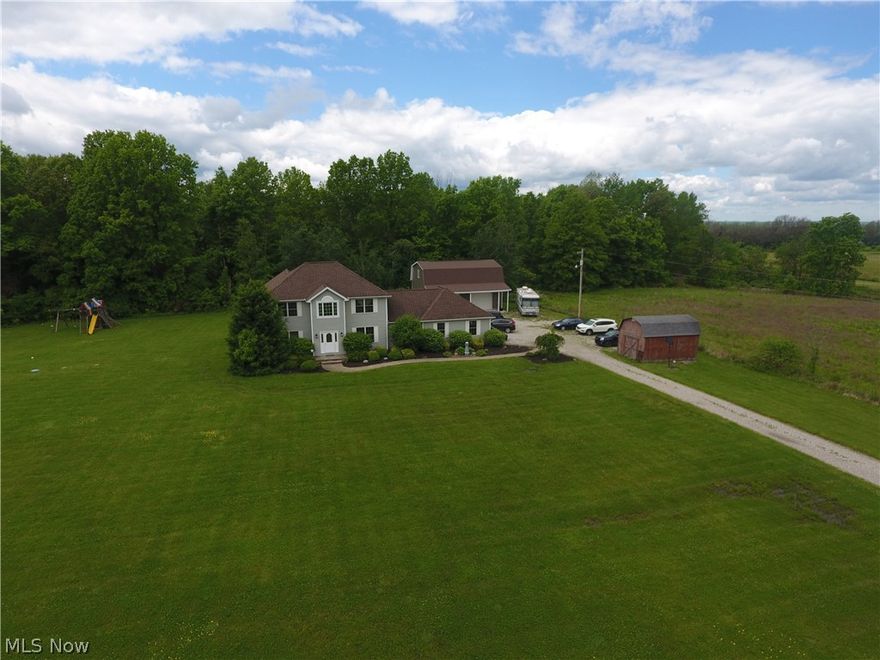 A Custom Built home by Riceland Homes has 4 bedrooms above ground and two in the finished basement with egress windows. The property has 6.68 acres of land, half wooded in a quiet secluded location.  The eat-in kitchen has an open feel with plenty of oak cabinets and a formal dining room with wood flooring.  The large great room has french doors leading to the deck by the pool. The basement has two large rooms used as bedrooms by the sellers(15' x 13'), a bathroom, another office, bonus area, and a large media room with overhead projector for entertainment.  The three car attached garage has a wheel chair lift which is negotiable.  The 40' x 30' Barn has a concrete floor and a full 2nd floor for easy storage.  Call today for your private showing.