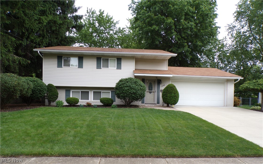 Welcome to 2199 Bryn Mawr - a unique bi-level with 4 bedrooms, 1 full bath and 2 half baths. The lower level includes a large living room, a kitchen with cherry cabinets and stainless steel appliances, and an eating area. There is also a large mudroom/laundry room, and a half bath. And, up just a few steps from the mudroom you will find a wonderful sunroom that walks out to a brick patio, and a large fenced back yard. In the back yard there is a large concrete pad. It would be a perfect spot for an outbuilding. On the 2nd floor there are four bedrooms and one full bath, and the master bedroom has its own half bath. All four bedrooms include ceiling fans w/overhead lighting! In 2014 the home was mitigated for radon. In 2015 the owner replaced the front entry door and storm door as well as both exterior doors in the sunroom. Also, in 2015 the owner replaced the garage door opener including two remotes and keyless entry to the garage. Updates in 2017 include a new furnace and A/C, the H2