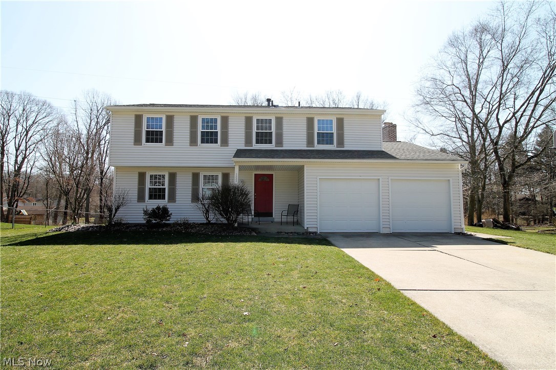 Welcome home to this bright and charming 4 bedroom, 2.5 bath colonial. Come on in from the front porch to the inviting foyer, living room, dining room, kitchen and family room which has all been freshly painted (2020). The large open, fabulous kitchen has abundant of cabinets, counters, windows to let the natural light to shine through and an eat in area for a full kitchen table which is open to the family room and has a wood burning fireplace with mantle and slider doors to the gorgeous new deck (2017), that was stained in (2020) and is used for entertaining, or just enjoy relaxing and looking out to the beautiful view of the large, tranquil backyard. The upper level you will find new carpet (2020), four bedrooms, one full bathroom updated in (2003). The large master suite offers a walk in closet, make up desk, bath updated in (2000). Totally finished fabulous basement has been waterproofed (2001), has so much more room for entertaining, workout area, laundry, etc. WOW! There is a two